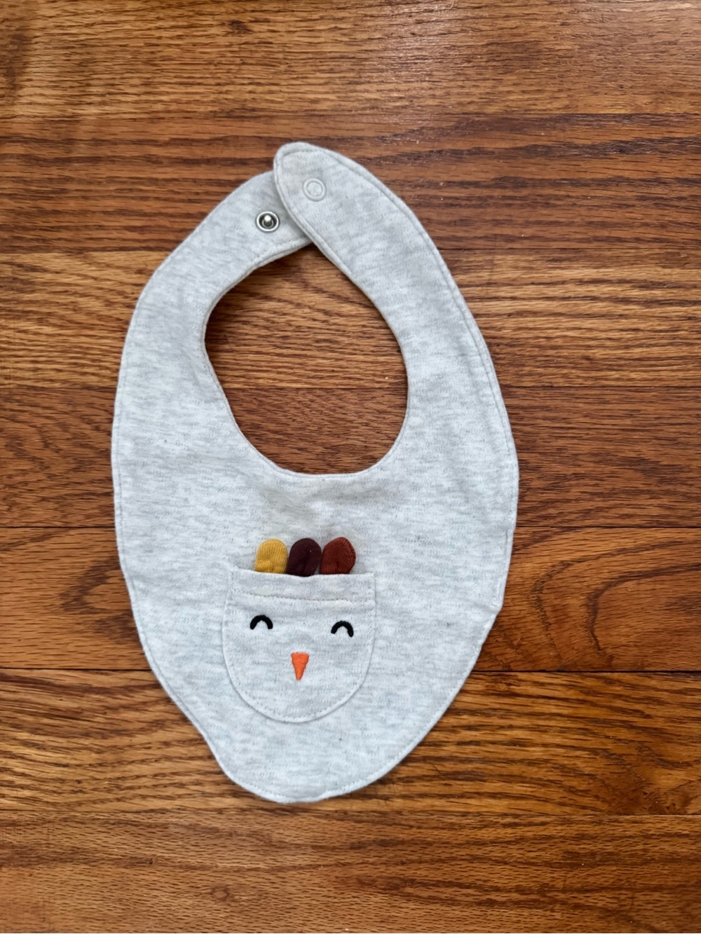 Carter's Light Gray Bib with Chick Pocket and Colorful Feathers